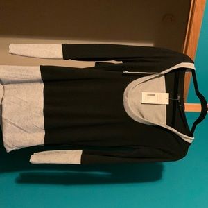 Long sleeve top black and gray.  Never worn. Tag says XL fits like S/M